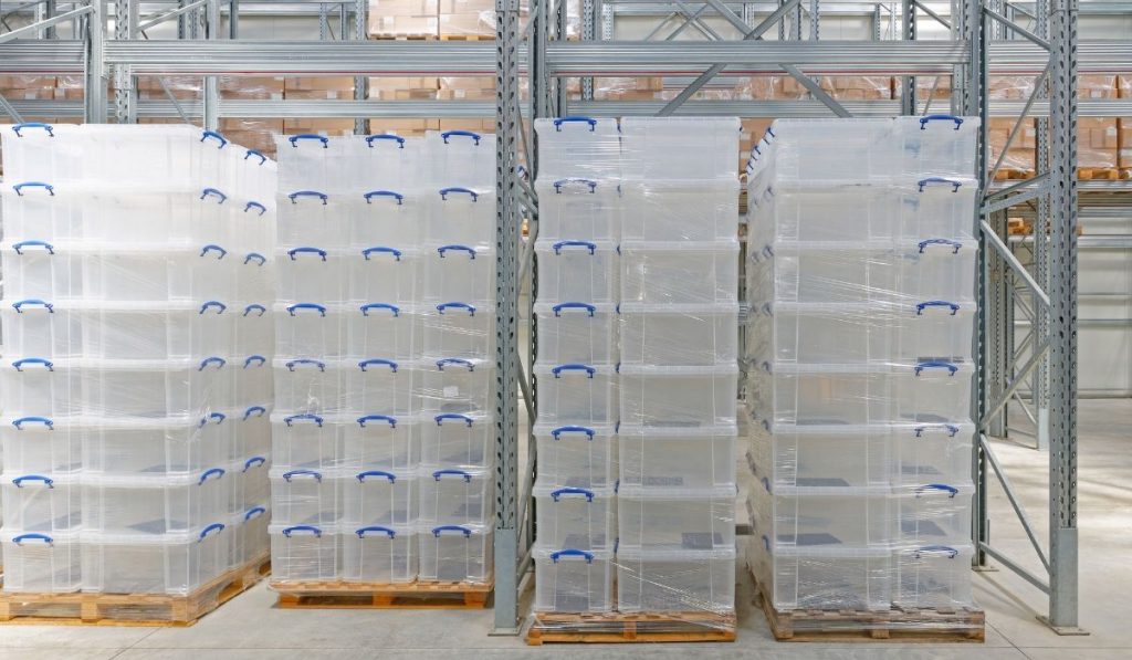 clear plastic containers in a warehouse