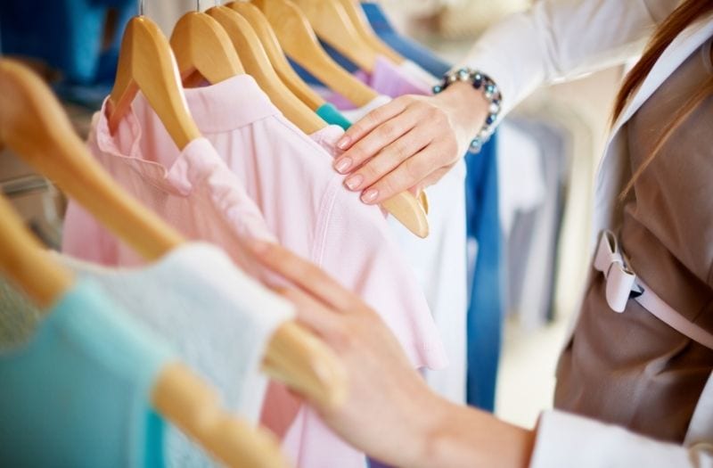 woman organizing her clothes for work and for play